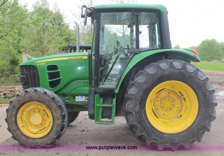 image for item K6868 2010 John Deere 6330 MFWD tractor