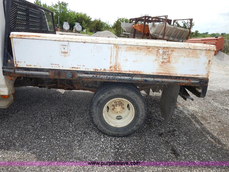 image for item J3956 1985 Ford F350 flatbed pickup truck