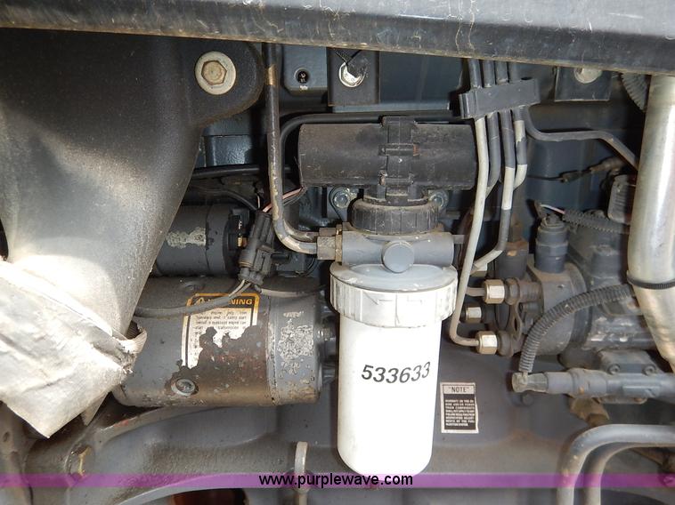 image for item J3960 1998 New Holland TS100 tractor