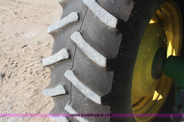 image for item K6949 2006 John Deere 6415 MFWD tractor