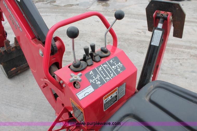 image for item H5815 Mahindra 595 backhoe attachment