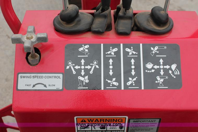 image for item H5815 Mahindra 595 backhoe attachment