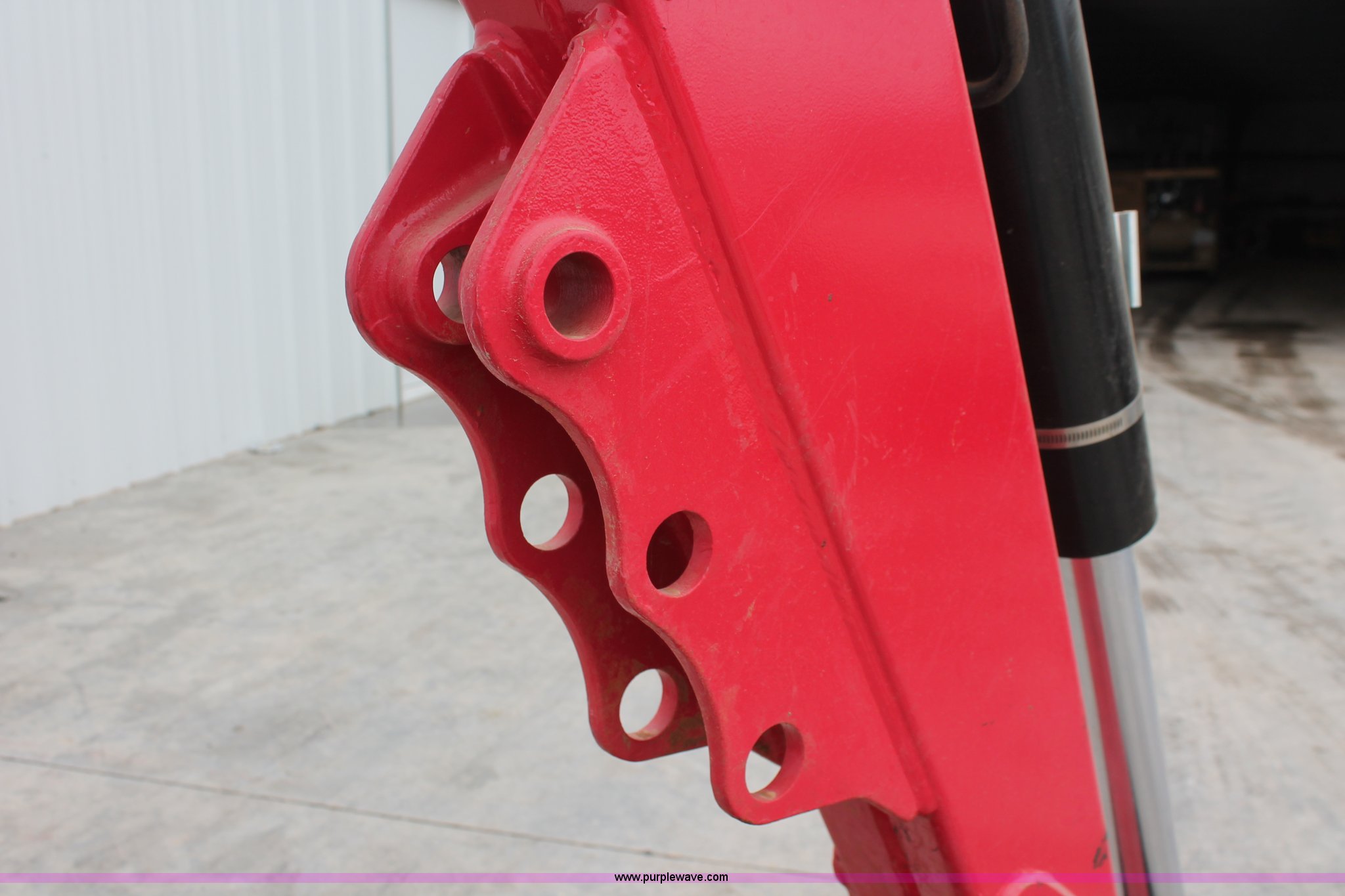 Mahindra 595 backhoe attachment in Norman, OK Item H5815 sold Purple Wave