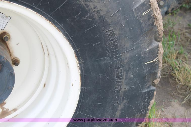 image for item H1506 2008 MacDon M200 self-propelled windrower