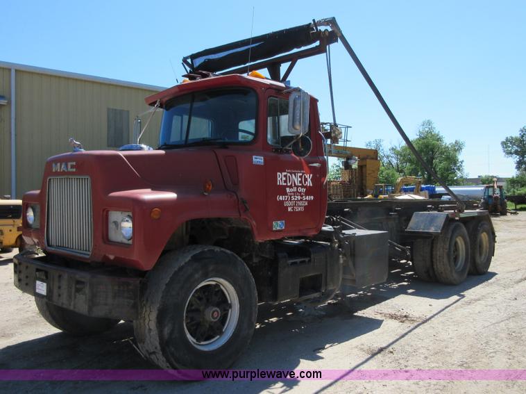 image for item D2435 1981 Mack DM6855 roll off truck