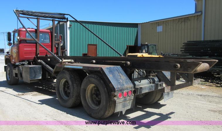 image for item D2435 1981 Mack DM6855 roll off truck