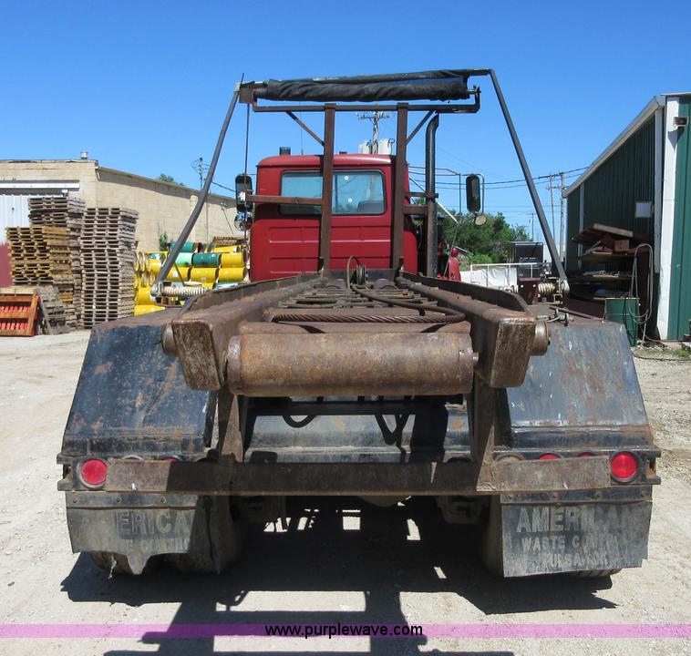 image for item D2435 1981 Mack DM6855 roll off truck