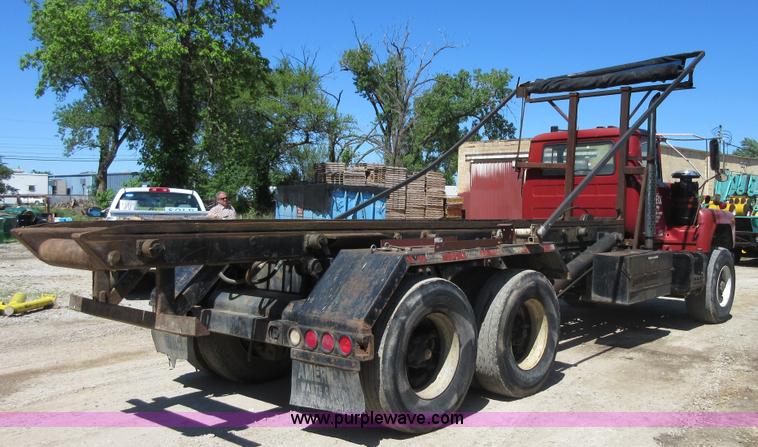 image for item D2435 1981 Mack DM6855 roll off truck