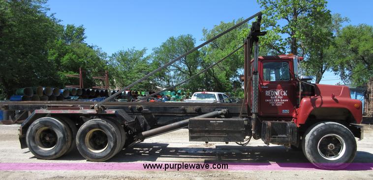 image for item D2435 1981 Mack DM6855 roll off truck