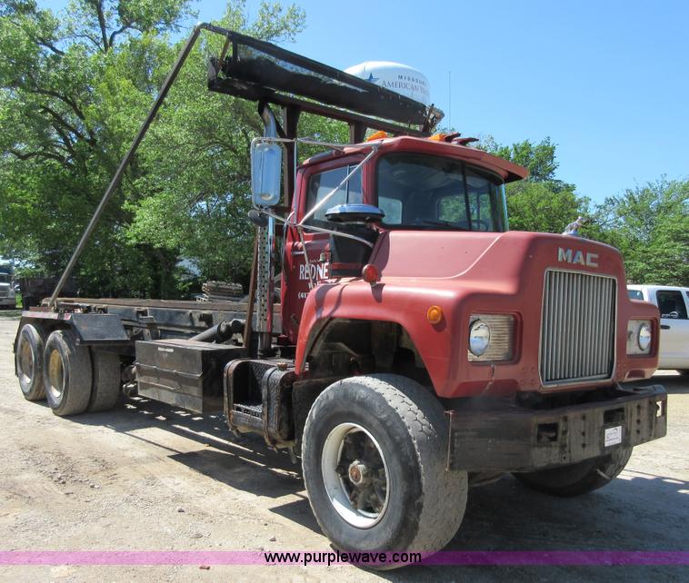 image for item D2435 1981 Mack DM6855 roll off truck