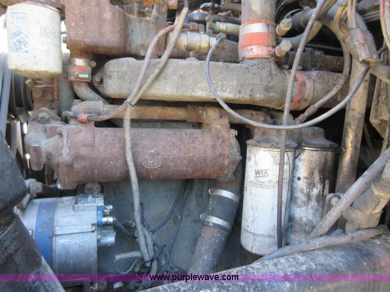 image for item D2435 1981 Mack DM6855 roll off truck