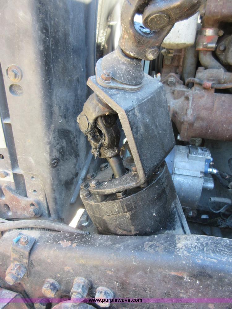 image for item D2435 1981 Mack DM6855 roll off truck