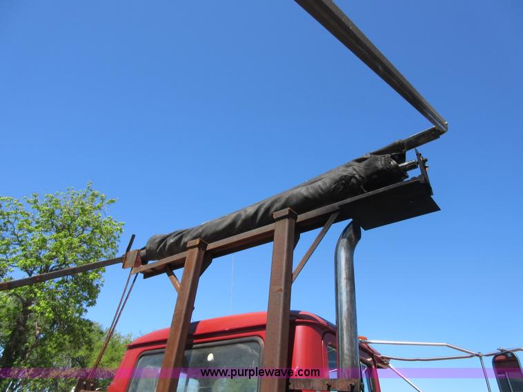 image for item D2435 1981 Mack DM6855 roll off truck