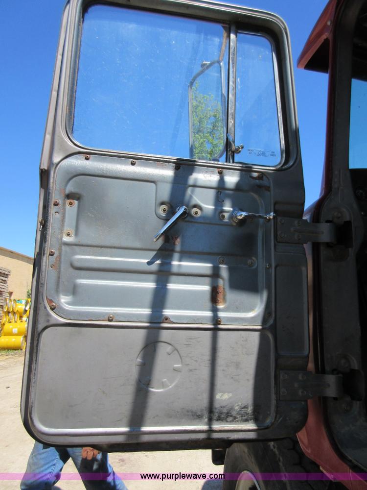 image for item D2435 1981 Mack DM6855 roll off truck