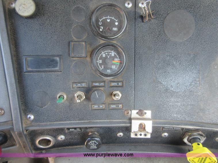 image for item D2435 1981 Mack DM6855 roll off truck