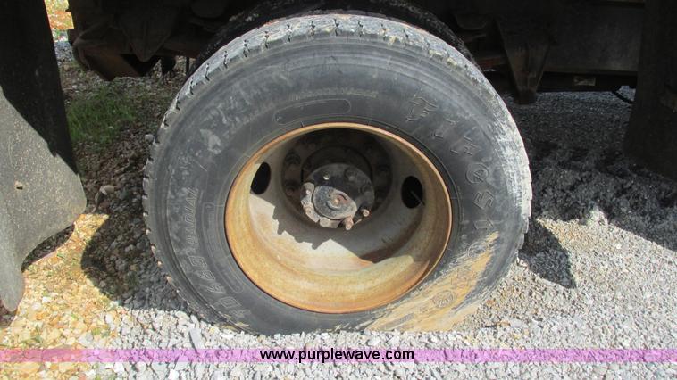 image for item J8516 2002 International 4900 Crew Cab dump truck