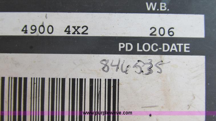 image for item J8516 2002 International 4900 Crew Cab dump truck