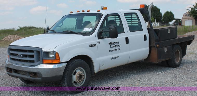image for item H5794 1999 Ford F350 Super Duty XL Crew Cab flatbed pickup truck