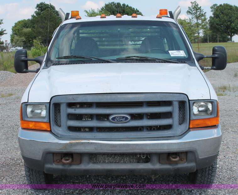 image for item H5794 1999 Ford F350 Super Duty XL Crew Cab flatbed pickup truck