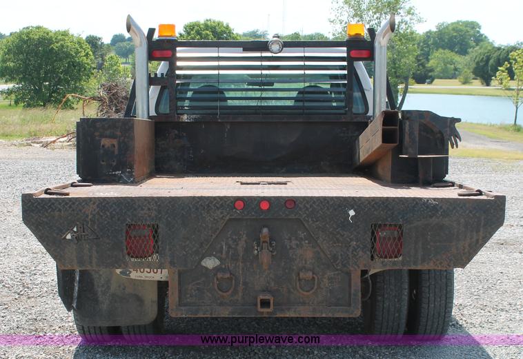 image for item H5794 1999 Ford F350 Super Duty XL Crew Cab flatbed pickup truck