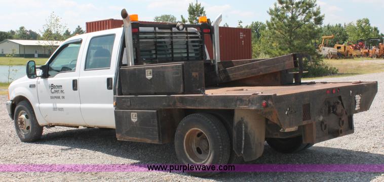 image for item H5794 1999 Ford F350 Super Duty XL Crew Cab flatbed pickup truck