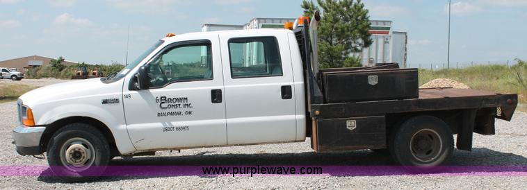 image for item H5794 1999 Ford F350 Super Duty XL Crew Cab flatbed pickup truck