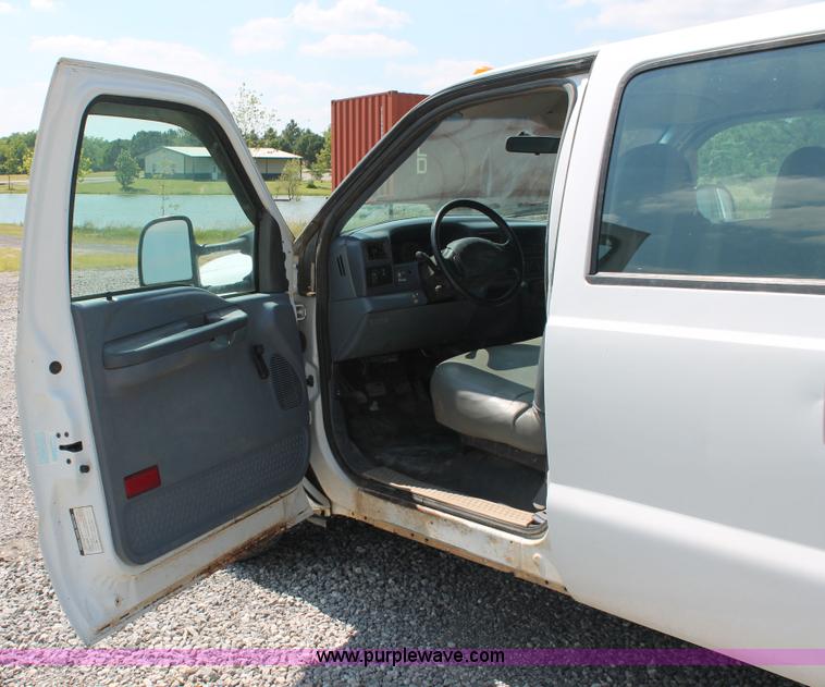 image for item H5794 1999 Ford F350 Super Duty XL Crew Cab flatbed pickup truck