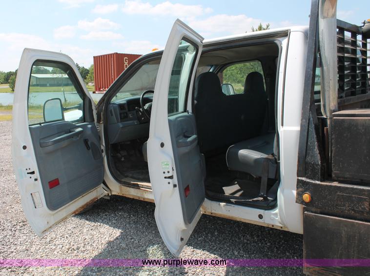 image for item H5794 1999 Ford F350 Super Duty XL Crew Cab flatbed pickup truck