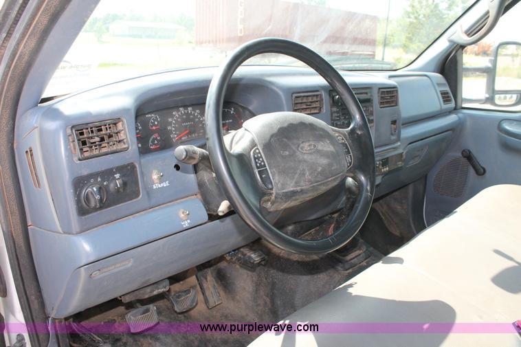 image for item H5794 1999 Ford F350 Super Duty XL Crew Cab flatbed pickup truck