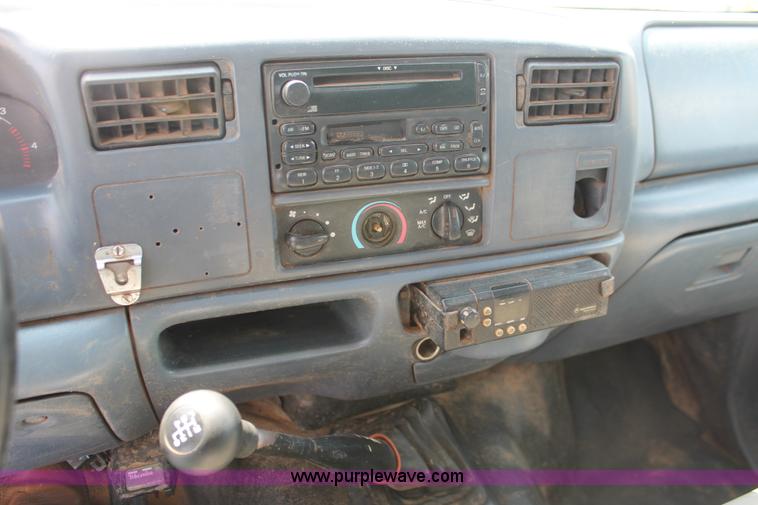 image for item H5794 1999 Ford F350 Super Duty XL Crew Cab flatbed pickup truck