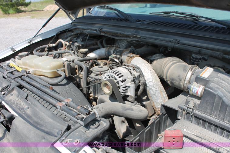 image for item H5794 1999 Ford F350 Super Duty XL Crew Cab flatbed pickup truck