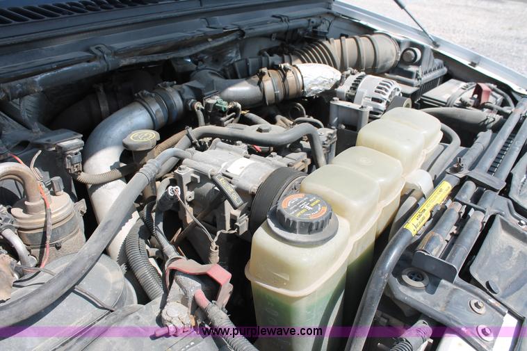 image for item H5794 1999 Ford F350 Super Duty XL Crew Cab flatbed pickup truck