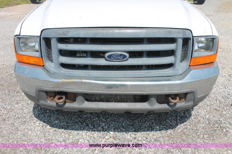 image for item H5794 1999 Ford F350 Super Duty XL Crew Cab flatbed pickup truck