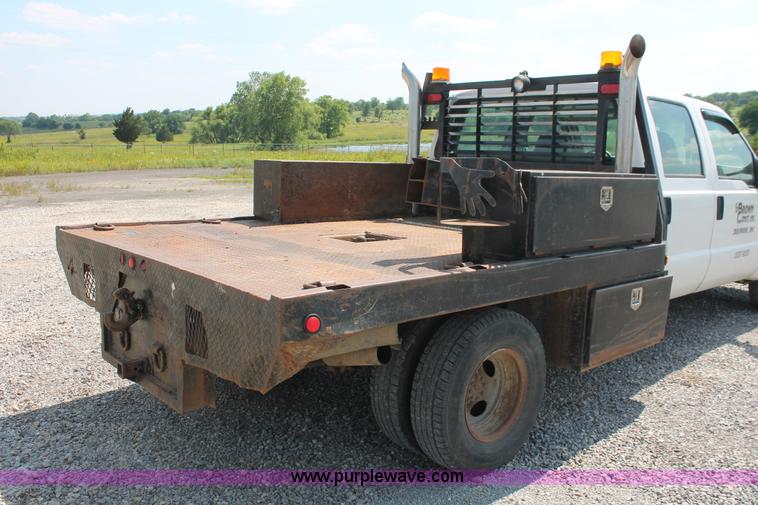 image for item H5794 1999 Ford F350 Super Duty XL Crew Cab flatbed pickup truck