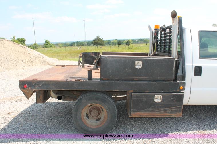 image for item H5794 1999 Ford F350 Super Duty XL Crew Cab flatbed pickup truck