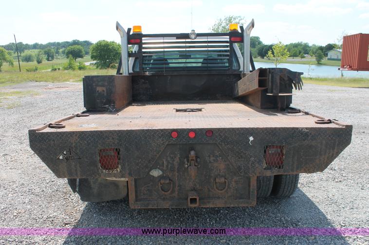 image for item H5794 1999 Ford F350 Super Duty XL Crew Cab flatbed pickup truck