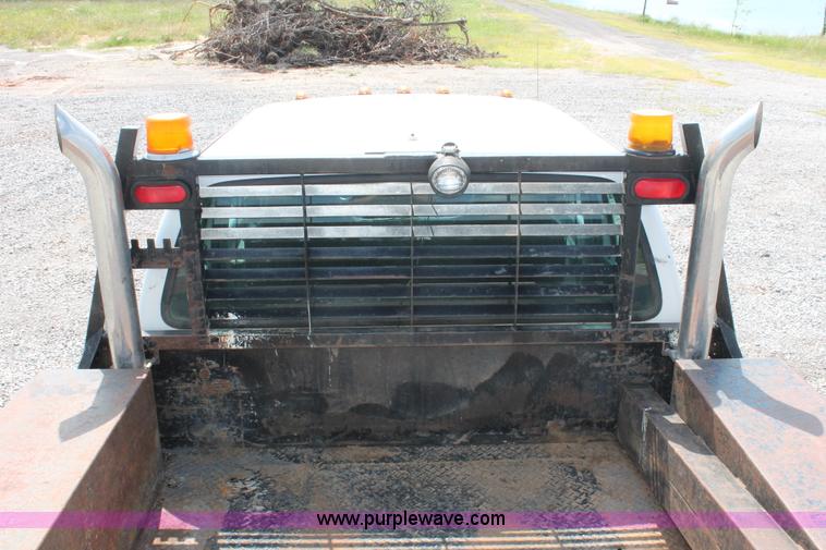 image for item H5794 1999 Ford F350 Super Duty XL Crew Cab flatbed pickup truck