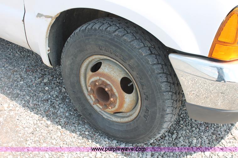 image for item H5794 1999 Ford F350 Super Duty XL Crew Cab flatbed pickup truck