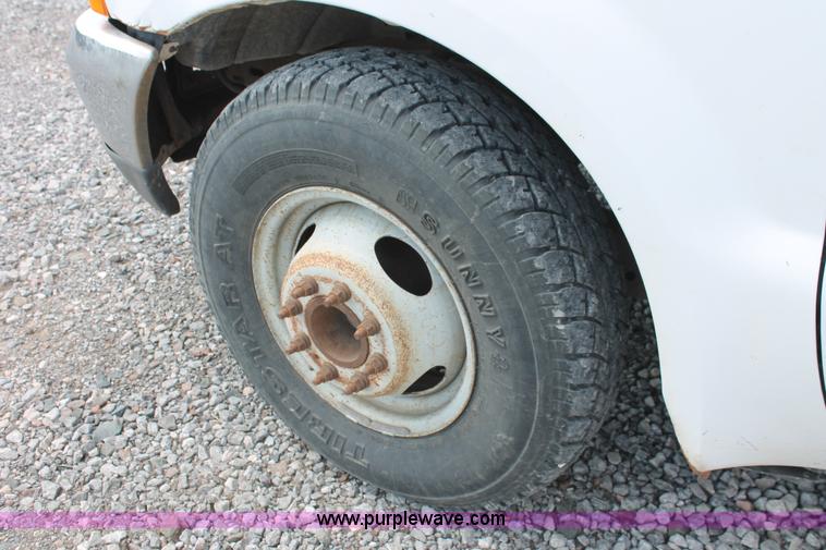 image for item H5794 1999 Ford F350 Super Duty XL Crew Cab flatbed pickup truck