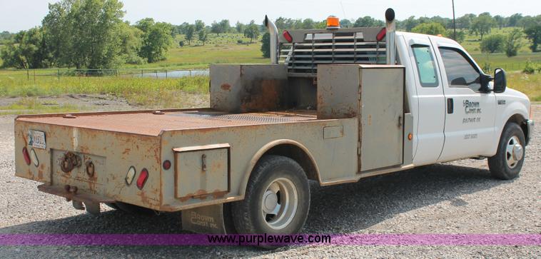 image for item H5797 2001 Ford F350 Super Duty XL SuperCab flatbed pickup truck