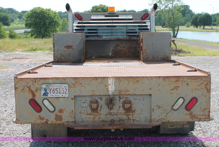 image for item H5797 2001 Ford F350 Super Duty XL SuperCab flatbed pickup truck