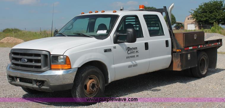 image for item H5798 2000 Ford F350 Super Duty XL Crew Cab flatbed pickup truck