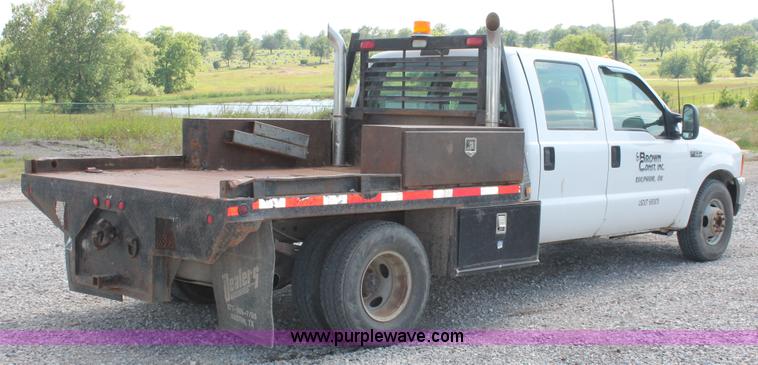 image for item H5798 2000 Ford F350 Super Duty XL Crew Cab flatbed pickup truck