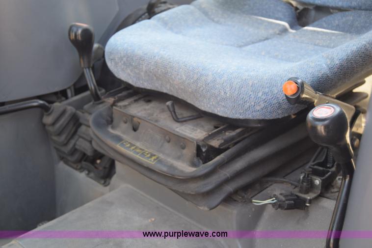 image for item K8569 2004 New Holland TN75DA tractor