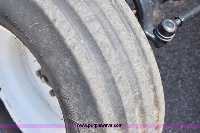 image for item K8569 2004 New Holland TN75DA tractor