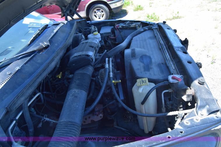 image for item J6606 1999 Dodge Ram 1500 Quad Cab pickup truck