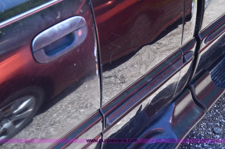 image for item J6606 1999 Dodge Ram 1500 Quad Cab pickup truck