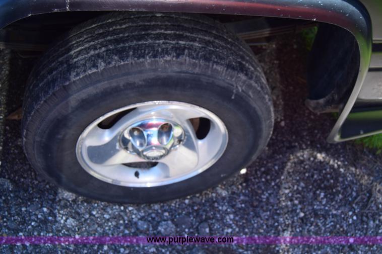 image for item J6606 1999 Dodge Ram 1500 Quad Cab pickup truck