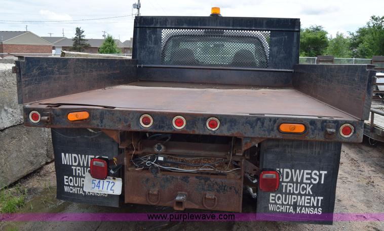 image for item J6638 2001 Ford F350 Super Duty flatbed pickup truck