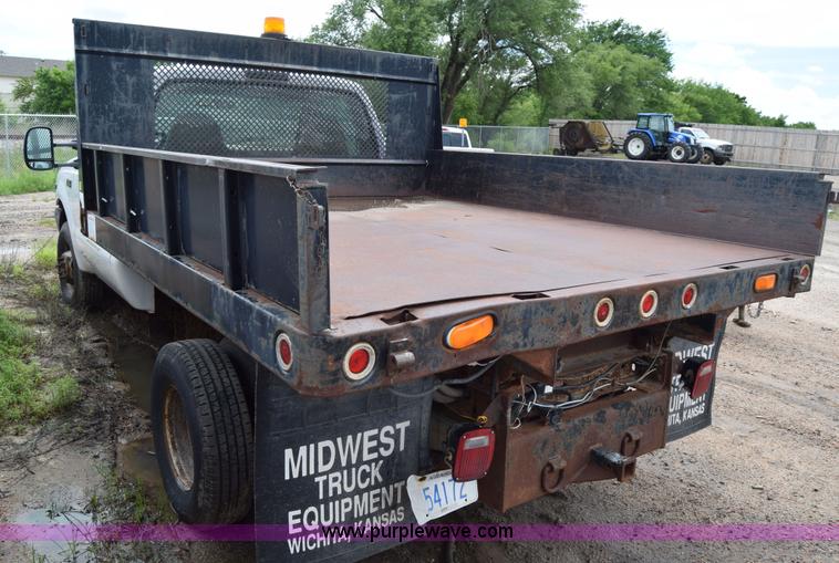 image for item J6638 2001 Ford F350 Super Duty flatbed pickup truck